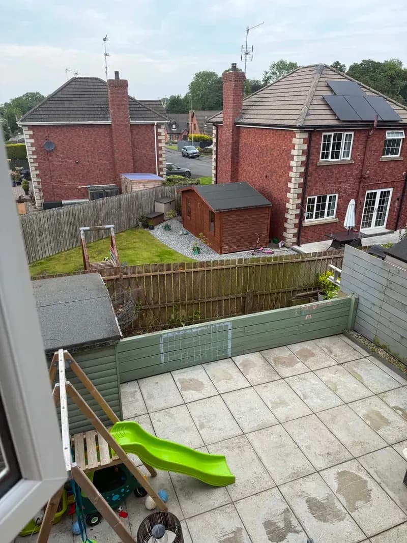 Patio flooded with light after complete laurel hedge removal, Co. Tyrone